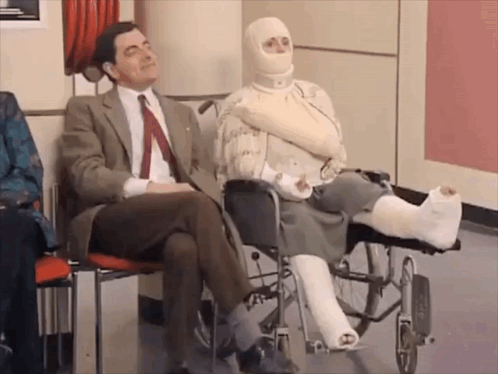 Man In Suit And Tie Next To Woman In Wheelchair GIF