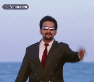 Man In Suit And Tie On Beach GIF