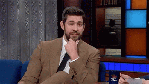 Man In Suit And Tie On Chair GIF