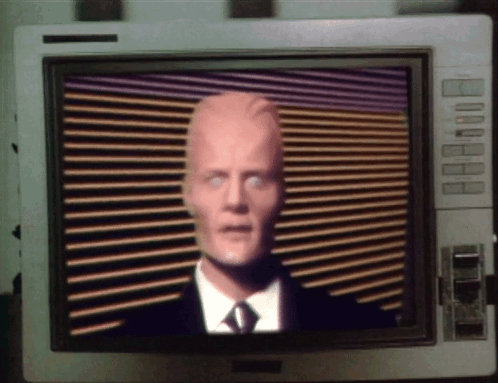 Man In Suit And Tie On Monitor GIF