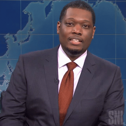 Man in Suit and Tie on SNL Television