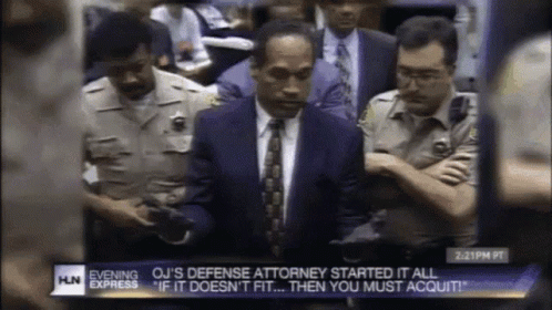 Man in Suit and Tie on TV