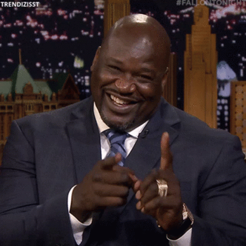 Man in Suit and Tie Pointing Finger