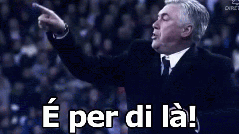 Man in Suit and Tie Pointing Saying e per di la