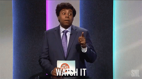 Man in Suit and Tie Pointing Saying Watch It