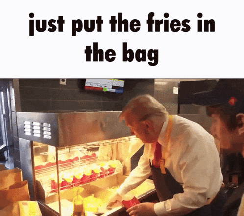 Man in Suit and Tie Putting French Fries Into Bag
