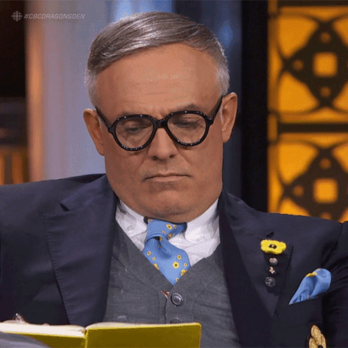 Man In Suit And Tie Reading Book #Cbcdragonsden GIF