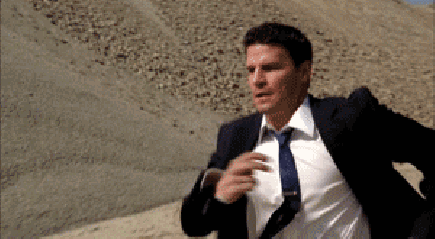 Man in Suit and Tie Running