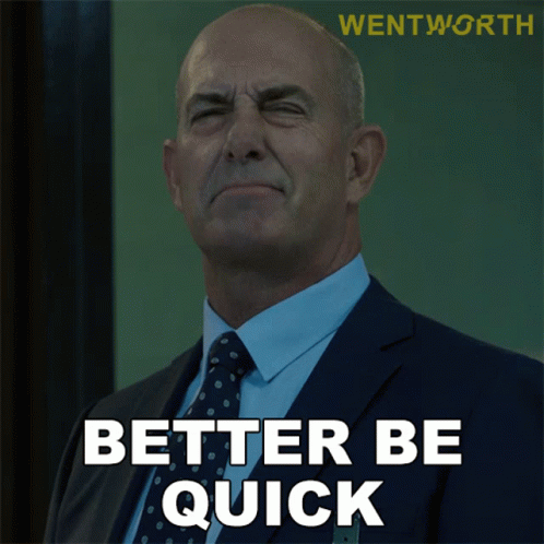 Man in Suit and Tie Saying Better Be Quick