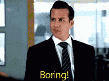 Man In Suit And Tie Saying Boring GIF