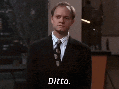 Man in Suit and Tie Saying Ditto