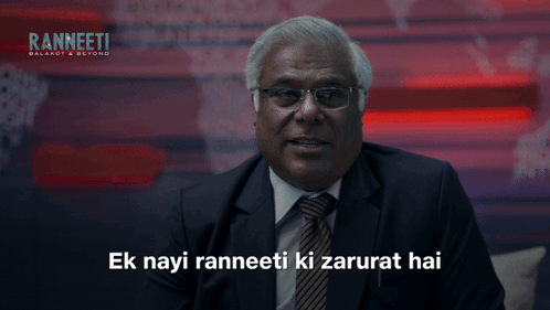 Man in Suit and Tie Saying Ek Nayi Ranneeti Ki Zarurat Hai