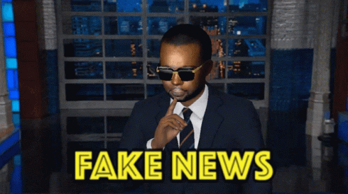 Man in Suit and Tie Saying Fake News