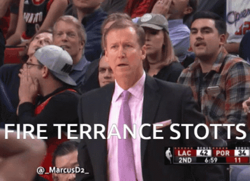 Man in Suit and Tie Saying Fire Terrance Stotts