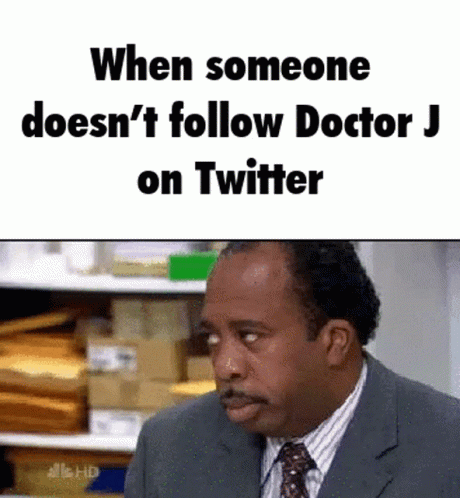 Man in Suit and Tie Saying Follow Doctor J