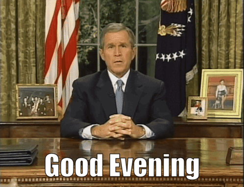 Man in Suit and Tie Saying Good Evening