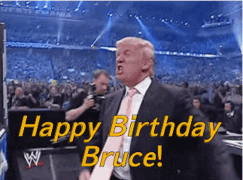 Man in Suit and Tie Saying Happy Birthday Bruce