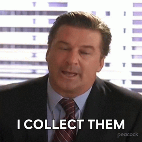 Man In Suit And Tie Saying I Collect Them GIF
