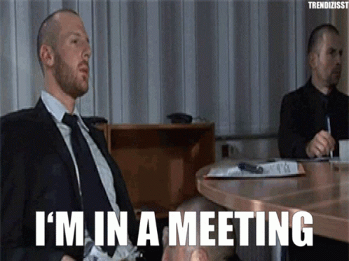 Man in Suit and Tie Saying I'm In a Meeting