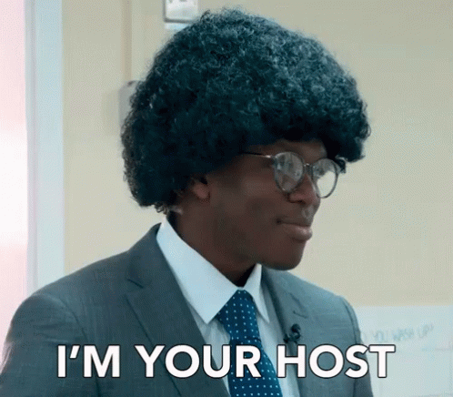 Man in Suit and Tie Saying I'm Your Host