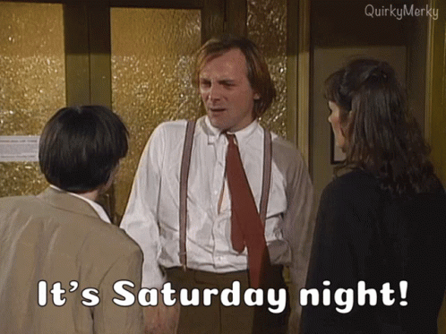 Man In Suit And Tie Saying It's Saturday Night To Two People GIF