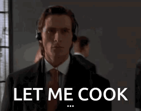 Man in Suit and Tie Saying Let Me Cook