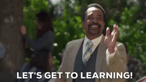 Man In Suit And Tie Saying Let's Get To Learning GIF