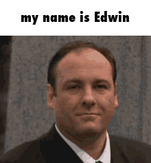 Man in Suit and Tie Saying My Name Is Edwin