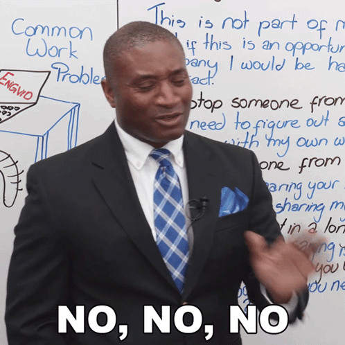 Man in Suit and Tie Saying No No No