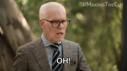 Man in Suit and Tie Saying Oh