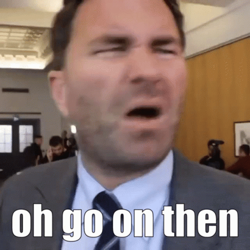 Man In Suit And Tie Saying Oh Go On Then GIF