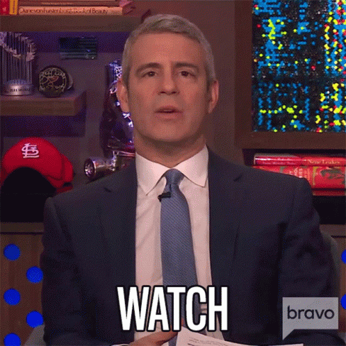 Man in Suit and Tie Saying Watch