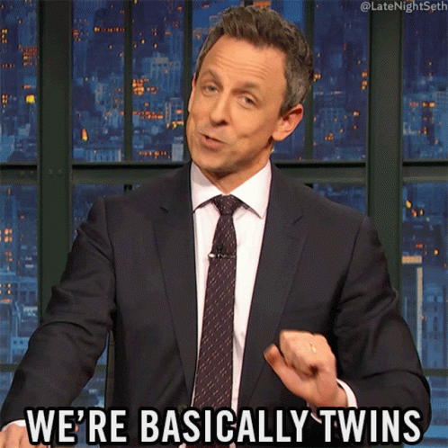 Man in Suit and Tie Saying We Are Basically Twins