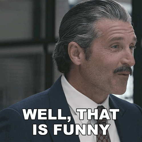 Man in Suit and Tie Saying Well That Is Funny