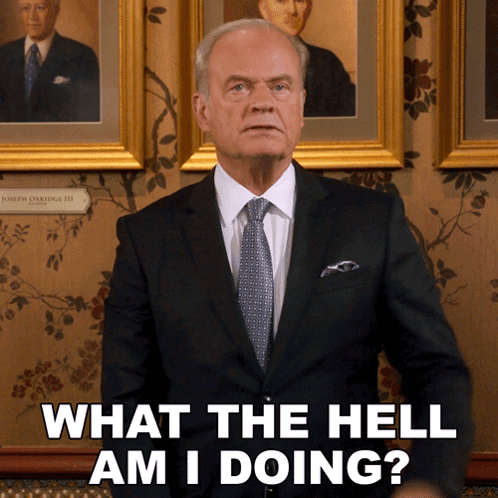 Man in Suit and Tie Saying What The Hell