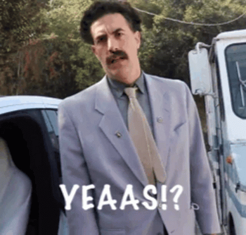 Man In Suit And Tie Saying Yeaas GIF