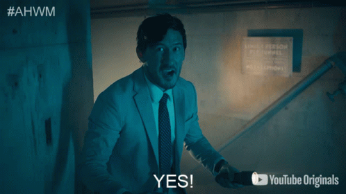 Man In Suit And Tie Saying Yes GIF