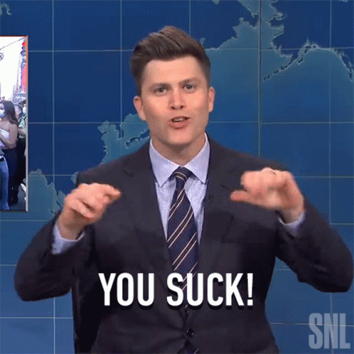 Man in Suit and Tie Saying You Suck