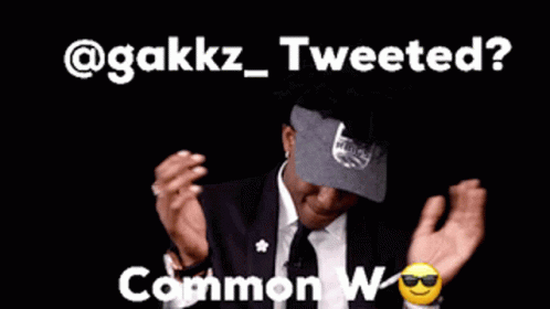 Man in Suit and Tie Says @gakkz Tweeted Common