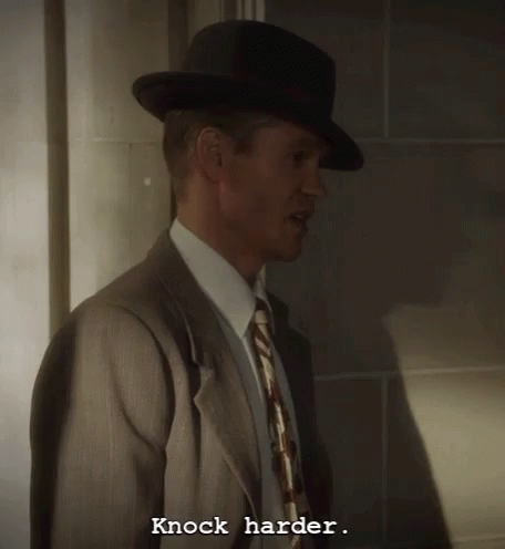 Man in Suit and Tie Says Knock Harder
