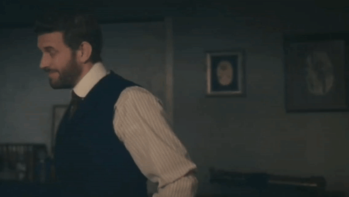 Man in Suit and Tie Says Little Bit Far Fetched