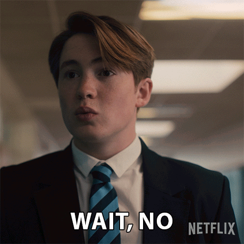 Man in Suit and Tie Says Wait No
