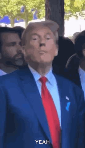 Man in Suit and Tie Says Yeah to Crowd