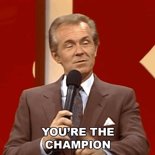 Man in Suit and Tie Says You're Champion