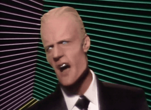 Man In Suit And Tie Screaming Into Microphone With Sunglasses GIF