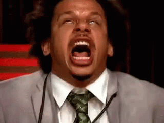 Man In Suit And Tie Screaming Into Microphone GIF