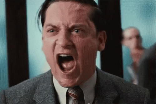 Man in Suit and Tie Screaming
