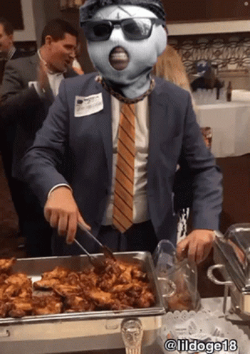 Man In Suit And Tie Serving Food From Buffet Tray @Lildoge18 GIF