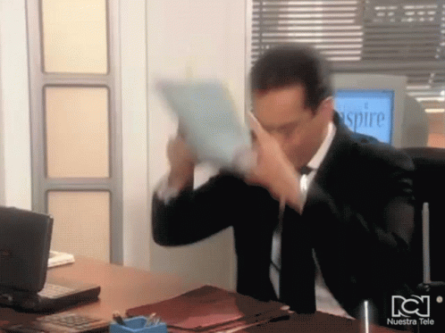 Man In Suit And Tie Sitting At Desk In Front Of Aspire Monitor GIF