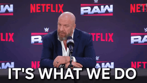 Man In Suit And Tie Sitting At Microphone GIF